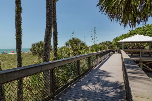 surrounding community featuring a gazebo and a water view