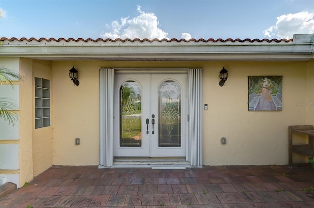 403 Picasso Dr, Nokomis, FL 34275 - property entrance with stucco siding and french doors