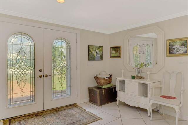 403 Picasso Dr, Nokomis, FL 34275 - foyer featuring french doors, light tile patterned floors, and crown molding