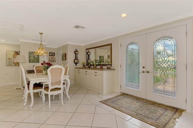 403 Picasso Dr, Nokomis, FL 34275 - entryway featuring crown molding, recessed lighting, french doors, light tile patterned floors, and visible vents