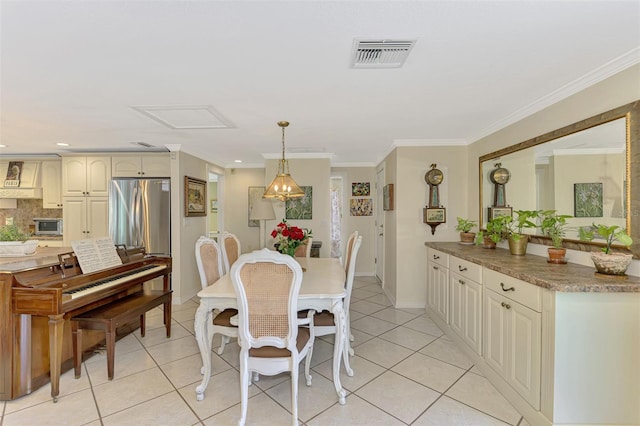 403 Picasso Dr, Nokomis, FL 34275 - dining room with light tile patterned floors, baseboards, visible vents, and crown molding
