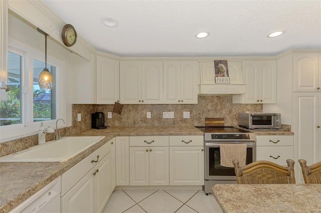 403 Picasso Dr, Nokomis, FL 34275 - kitchen with a toaster, stainless steel electric range oven, a sink, light tile patterned flooring, and dishwasher
