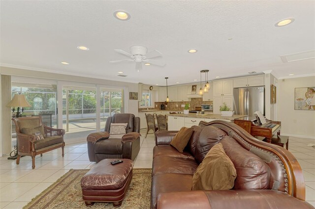 403 Picasso Dr, Nokomis, FL 34275 - living area featuring light tile patterned flooring, ornamental molding, recessed lighting, and a ceiling fan