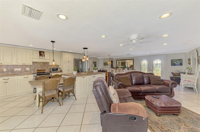 403 Picasso Dr, Nokomis, FL 34275 - living area with visible vents, crown molding, ceiling fan, recessed lighting, and light tile patterned floors