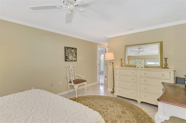 403 Picasso Dr, Nokomis, FL 34275 - bedroom featuring light tile patterned flooring, crown molding, and a textured ceiling