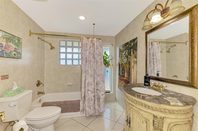 403 Picasso Dr, Nokomis, FL 34275 - bathroom with vanity, tile walls, toilet, tile patterned floors, and shower / bath combo