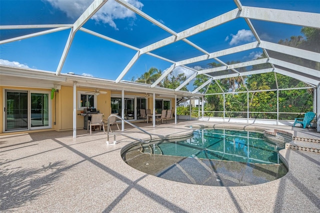 403 Picasso Dr, Nokomis, FL 34275 - outdoor pool featuring glass enclosure, grilling area, a patio, and a ceiling fan