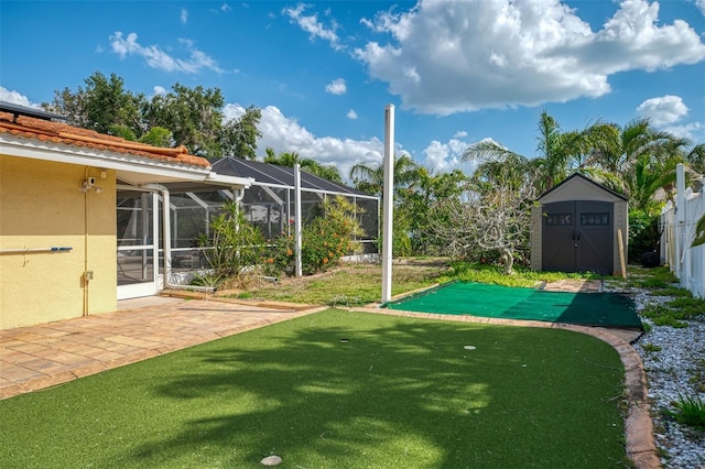 403 Picasso Dr, Nokomis, FL 34275 - view of yard with glass enclosure, an outdoor structure, fence, a storage shed, and a patio