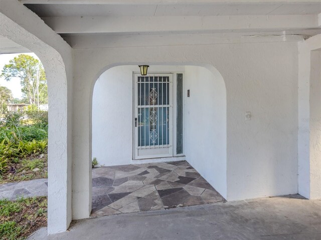 200 Sierra St S, Nokomis, FL 34275 - doorway to property featuring stucco siding