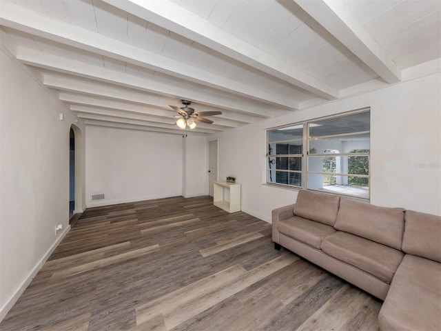 200 Sierra St S, Nokomis, FL 34275 - unfurnished living room with visible vents, beamed ceiling, ceiling fan, wood finished floors, and arched walkways