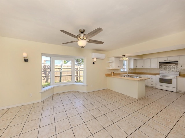 200 Sierra St S, Nokomis, FL 34275 - kitchen with a peninsula, tasteful backsplash, under cabinet range hood, electric stove, and an AC wall unit