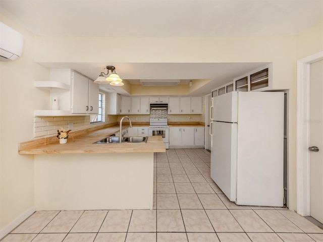 200 Sierra St S, Nokomis, FL 34275 - kitchen with a peninsula, white appliances, a sink, open shelves, and backsplash