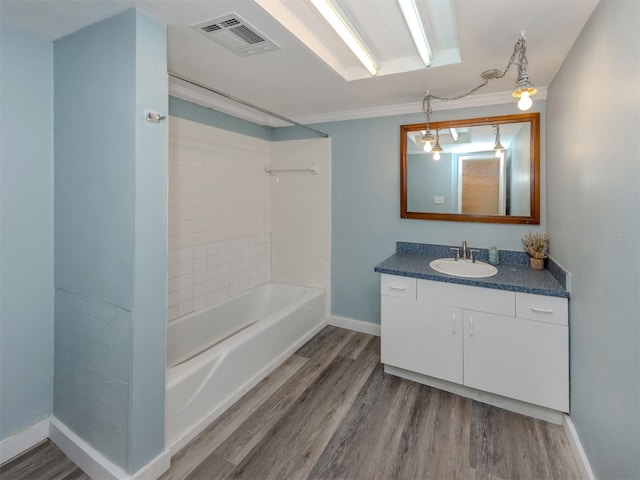 200 Sierra St S, Nokomis, FL 34275 - full bathroom featuring wood finished floors, vanity, baseboards, and visible vents