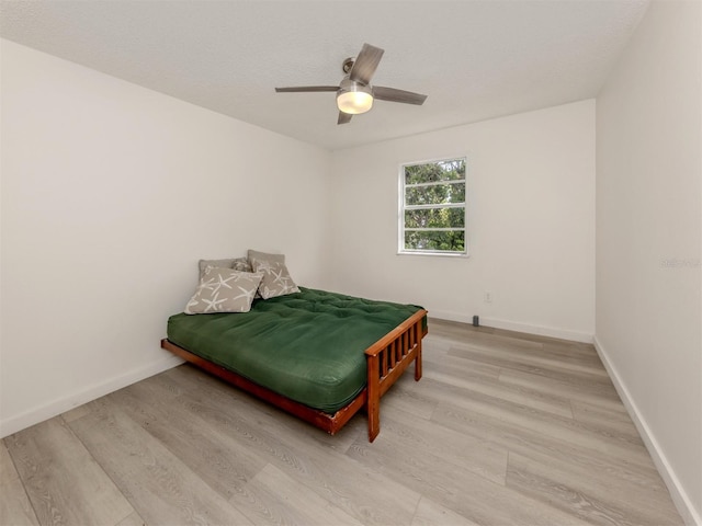 200 Sierra St S, Nokomis, FL 34275 - bedroom with baseboards, light wood-style floors, and ceiling fan
