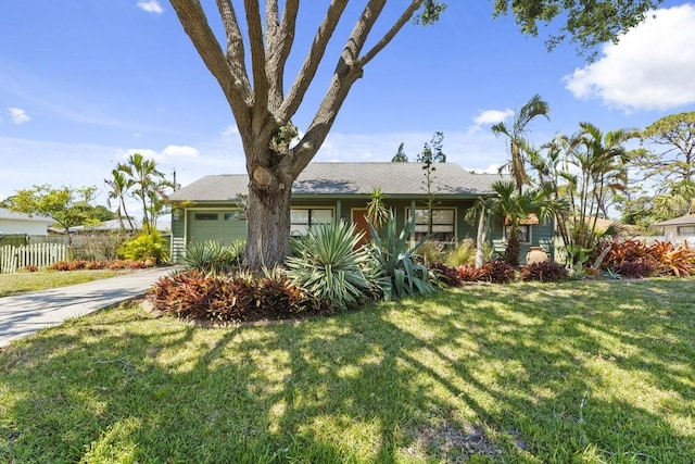 888 Kimball Rd, Venice, FL 34293 - ranch-style home with a garage, a front lawn, concrete driveway, and fence