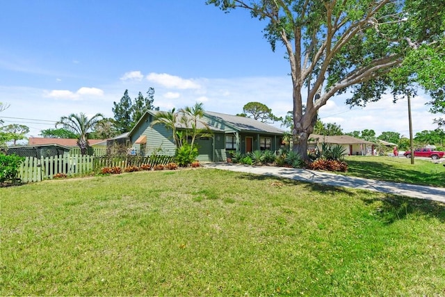 888 Kimball Rd, Venice, FL 34293 - view of front of property featuring a garage, a front lawn, and fence