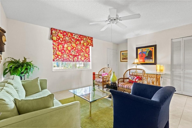 888 Kimball Rd, Venice, FL 34293 - living room featuring a ceiling fan, light tile patterned floors, and a textured ceiling