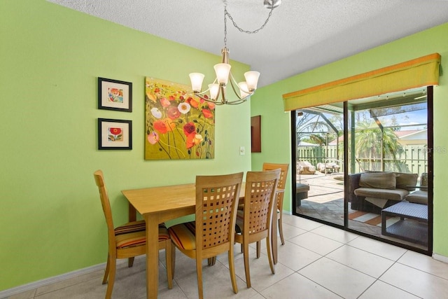 888 Kimball Rd, Venice, FL 34293 - dining space featuring light tile patterned floors, a textured ceiling, baseboards, and a notable chandelier