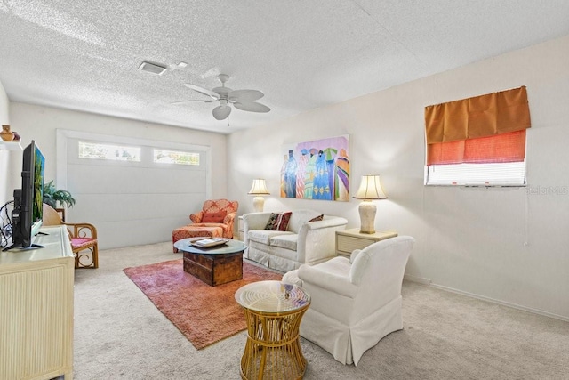 888 Kimball Rd, Venice, FL 34293 - living area featuring carpet flooring, a textured ceiling, visible vents, baseboards, and ceiling fan