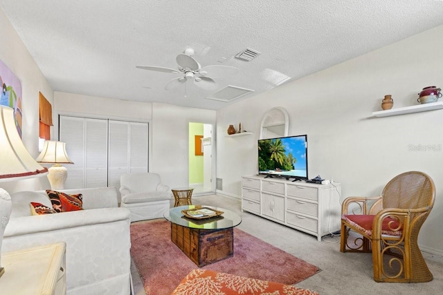 888 Kimball Rd, Venice, FL 34293 - living area with a ceiling fan, attic access, a textured ceiling, light colored carpet, and visible vents