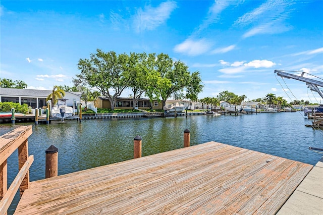 dock area with a water view and a residential view