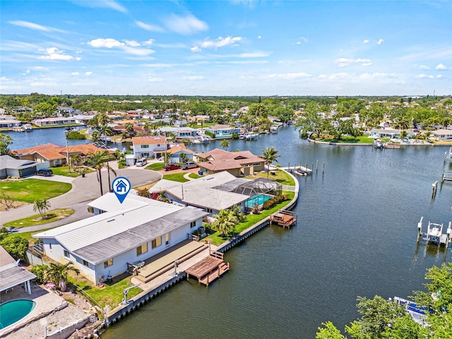 aerial view featuring a residential view and a water view