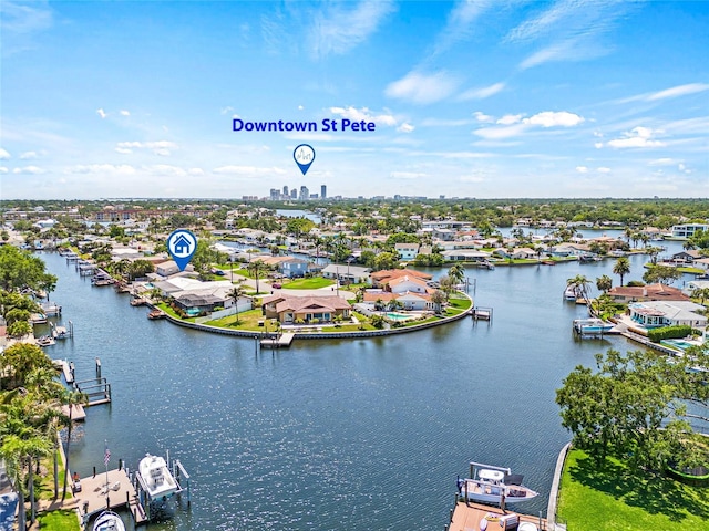drone / aerial view with a residential view and a water view