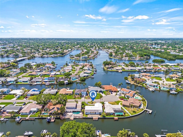 drone / aerial view featuring a water view and a residential view