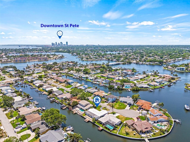 birds eye view of property with a residential view and a water view