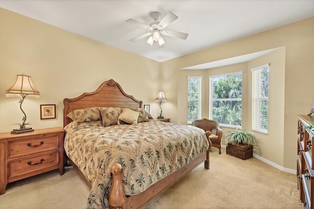 121 Auburn Woods Cir, Venice, FL 34292 - bedroom featuring light carpet, baseboards, and ceiling fan