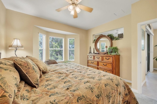 121 Auburn Woods Cir, Venice, FL 34292 - bedroom with baseboards, carpet flooring, and a ceiling fan