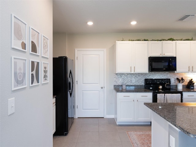 4907 Wedgeleaf Way, Palmetto, FL 34221 - kitchen featuring white cabinetry, visible vents, black appliances, and dark stone countertops