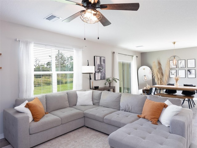 4907 Wedgeleaf Way, Palmetto, FL 34221 - living room with ceiling fan and visible vents
