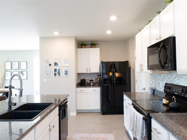 4907 Wedgeleaf Way, Palmetto, FL 34221 - kitchen featuring a sink, white cabinetry, backsplash, and black appliances