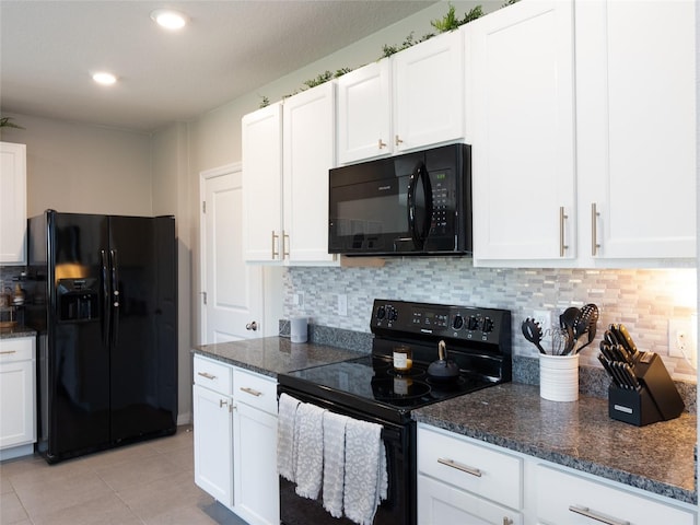 4907 Wedgeleaf Way, Palmetto, FL 34221 - kitchen featuring white cabinets, black appliances, and tasteful backsplash