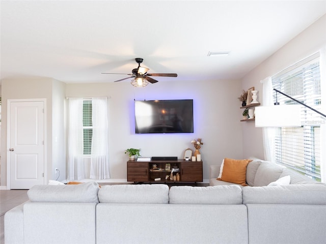 4907 Wedgeleaf Way, Palmetto, FL 34221 - living room with baseboards, tile patterned flooring, and a ceiling fan