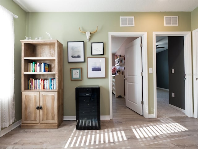 4907 Wedgeleaf Way, Palmetto, FL 34221 - interior space with baseboards, visible vents, and light wood finished floors
