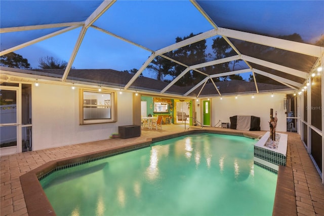 4305 Sandune Ave, North Port, FL 34287 - pool at twilight with a patio, an outdoor pool, and a lanai