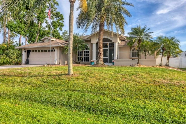 4305 Sandune Ave, North Port, FL 34287 - single story home with an attached garage, stucco siding, and driveway