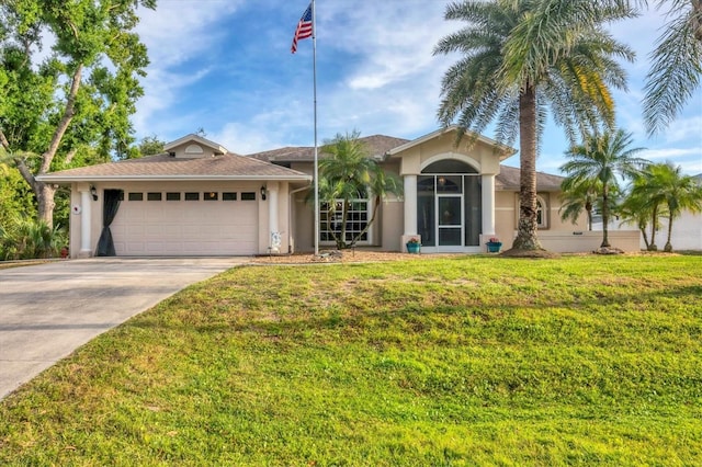 4305 Sandune Ave, North Port, FL 34287 - single story home featuring stucco siding, a garage, concrete driveway, and a front yard