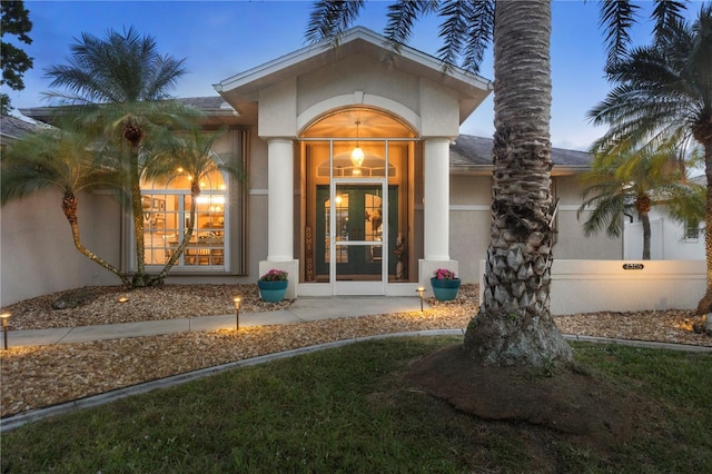 4305 Sandune Ave, North Port, FL 34287 - property entrance featuring stucco siding