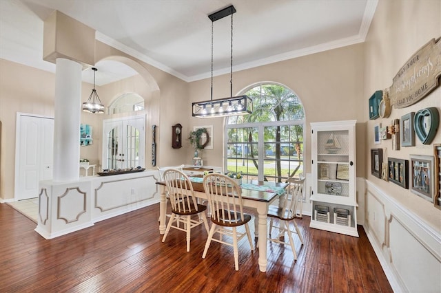 4305 Sandune Ave, North Port, FL 34287 - dining area featuring wood-type flooring, arched walkways, ornamental molding, and a chandelier
