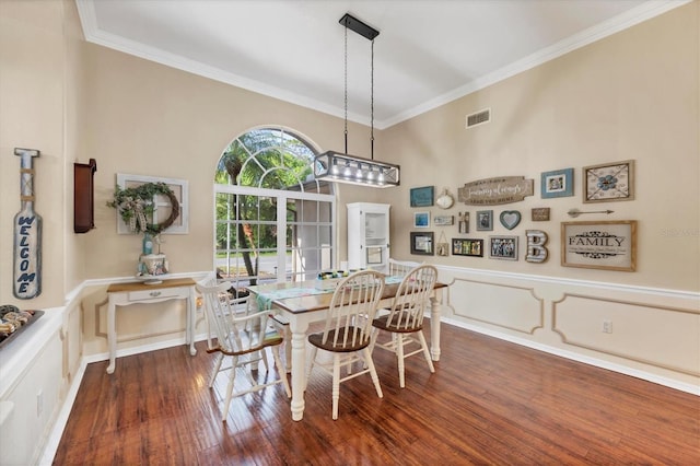 4305 Sandune Ave, North Port, FL 34287 - dining space featuring dark wood-style floors and crown molding