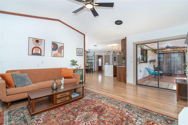 23 Tiffany St, Englewood, FL 34223 - living room featuring wood finished floors, ceiling fan, and vaulted ceiling
