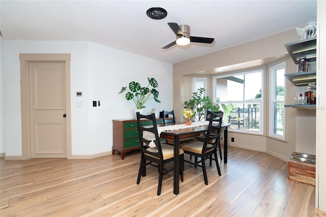 23 Tiffany St, Englewood, FL 34223 - dining room featuring light wood-style flooring, baseboards, and ceiling fan