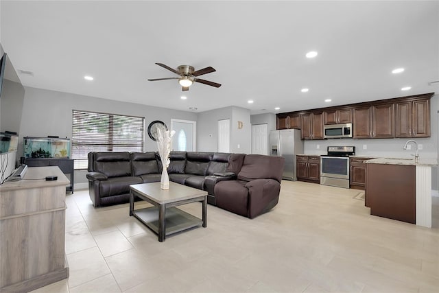4068 Palau Dr, Sarasota, FL 34241 - living area with a ceiling fan, recessed lighting, and light tile patterned floors