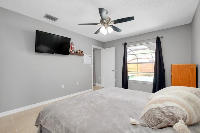 4068 Palau Dr, Sarasota, FL 34241 - bedroom with a textured ceiling and ceiling fan