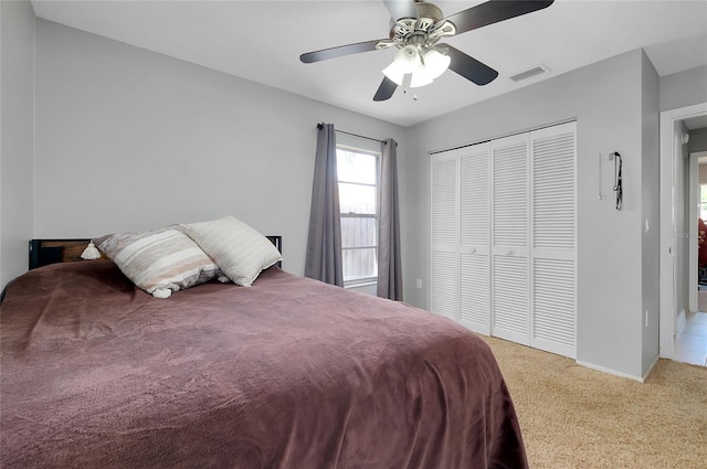 4068 Palau Dr, Sarasota, FL 34241 - bedroom featuring light carpet, a closet, and a ceiling fan
