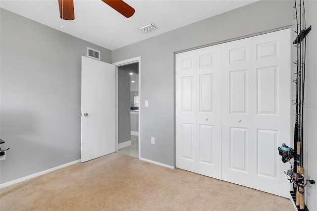 4068 Palau Dr, Sarasota, FL 34241 - unfurnished bedroom with carpet, a closet, and a ceiling fan