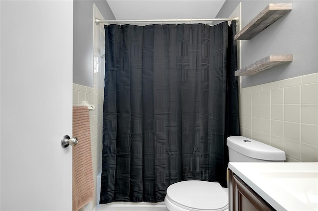 4068 Palau Dr, Sarasota, FL 34241 - full bath featuring tile walls, vanity, and a shower with shower curtain